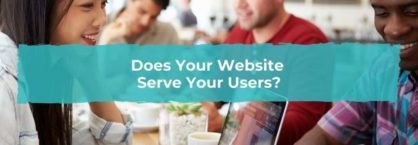 A group of people sit in a cafe and browse the internet on their laptops
