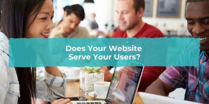 A group of people sit in a cafe and browse the internet on their laptops